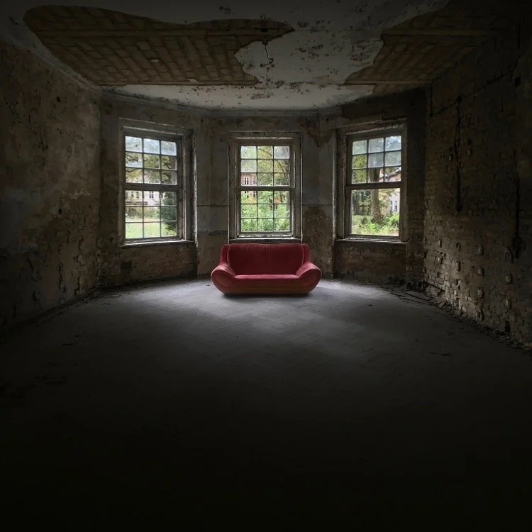 The iconic red sofa at the abandoned Heilstätten Grabowsee