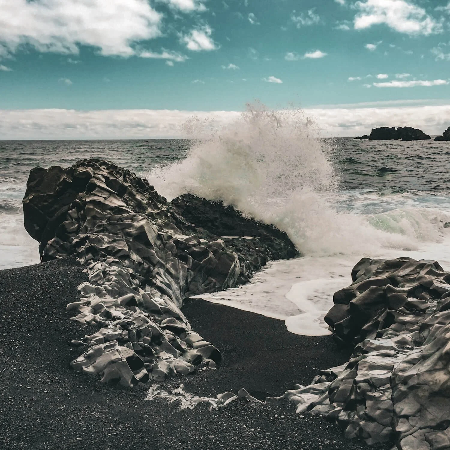 Waves breaking at the Black Beach in Iceland